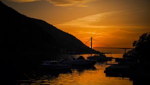 Preview wallpaper boats, bay, bridge, sunset, dark