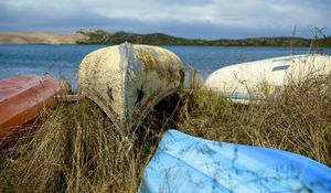 Preview wallpaper boats, canoes, grass, sea, hills