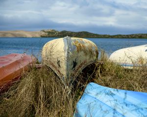 Preview wallpaper boats, canoes, grass, sea, hills