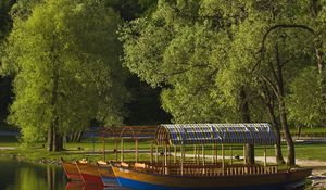 Preview wallpaper boats, coast, canopy, lake, slovenia, trees