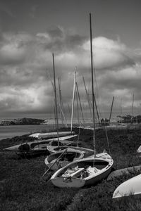 Preview wallpaper boats, grass, sea, clouds, black and white