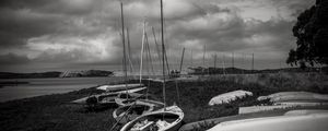 Preview wallpaper boats, grass, sea, clouds, black and white