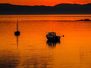 Preview wallpaper boats, lake, hills, sunset