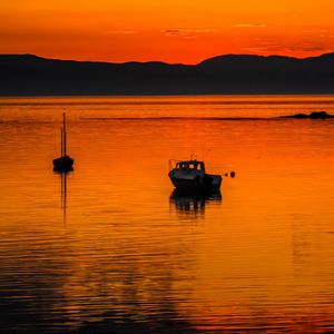 Preview wallpaper boats, lake, hills, sunset