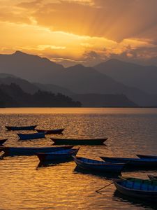 Preview wallpaper boats, lake, mountains, bay, sunset