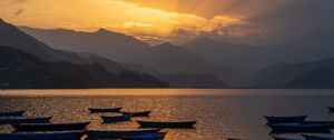 Preview wallpaper boats, lake, mountains, bay, sunset