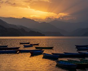 Preview wallpaper boats, lake, mountains, bay, sunset