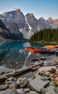 Preview wallpaper boats, lake, stones, mountains, snowy