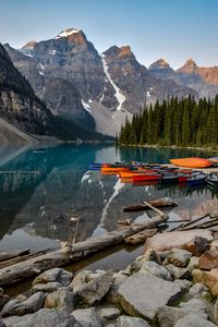 Preview wallpaper boats, lake, stones, mountains, snowy