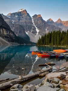 Preview wallpaper boats, lake, stones, mountains, snowy