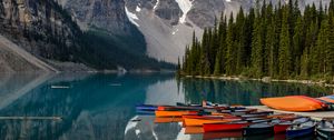 Preview wallpaper boats, lake, stones, mountains, snowy