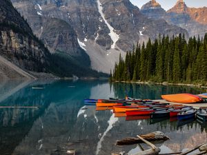 Preview wallpaper boats, lake, stones, mountains, snowy