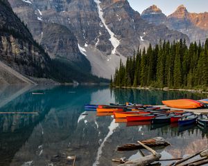 Preview wallpaper boats, lake, stones, mountains, snowy