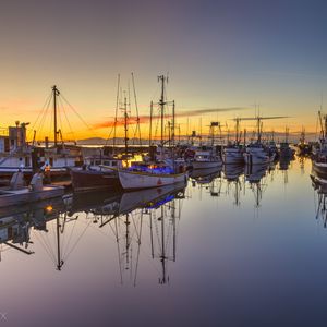 Preview wallpaper boats, masts, lake, reflection, sunrise