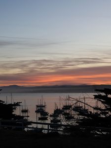 Preview wallpaper boats, masts, sea, evening, dark, silhouettes