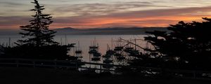 Preview wallpaper boats, masts, sea, evening, dark, silhouettes