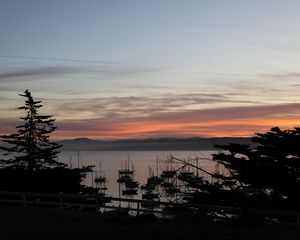 Preview wallpaper boats, masts, sea, evening, dark, silhouettes