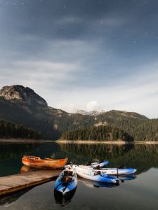 Preview wallpaper boats, mountains, lake, pier, starry sky, stars