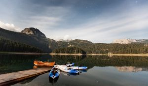 Preview wallpaper boats, mountains, lake, pier, starry sky, stars