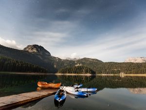 Preview wallpaper boats, mountains, lake, pier, starry sky, stars