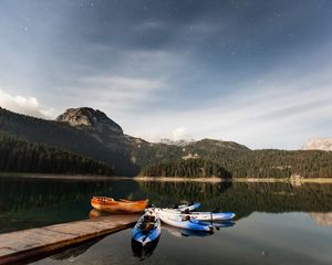 Preview wallpaper boats, mountains, lake, pier, starry sky, stars