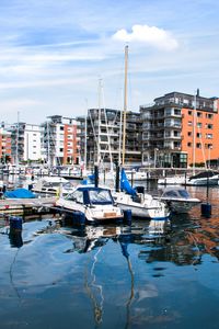 Preview wallpaper boats, pier, city, buildings, water