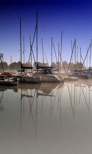 Preview wallpaper boats, pier, fog, water smooth surface, sailing vessels, morning