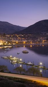 Preview wallpaper boats, pier, lights, mountains, twilight