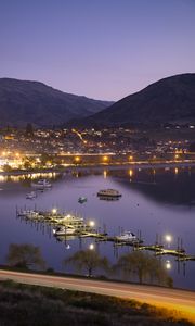 Preview wallpaper boats, pier, lights, mountains, twilight