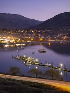 Preview wallpaper boats, pier, lights, mountains, twilight