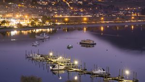 Preview wallpaper boats, pier, lights, mountains, twilight