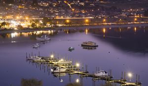 Preview wallpaper boats, pier, lights, mountains, twilight