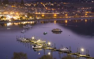 Preview wallpaper boats, pier, lights, mountains, twilight