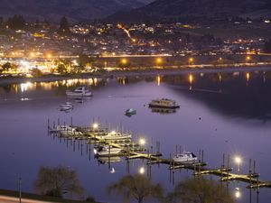 Preview wallpaper boats, pier, lights, mountains, twilight