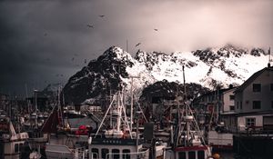 Preview wallpaper boats, pier, mountains, birds, snow covered