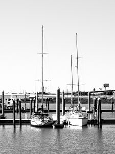 Preview wallpaper boats, pier, pilings, black and white