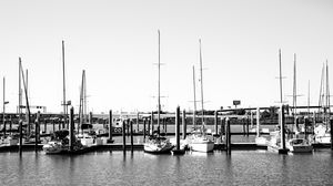 Preview wallpaper boats, pier, pilings, black and white