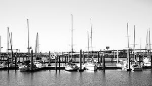 Preview wallpaper boats, pier, pilings, black and white