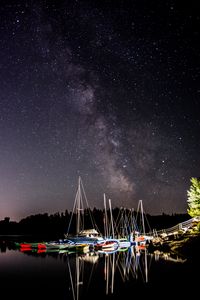Preview wallpaper boats, pier, river, night, milky way