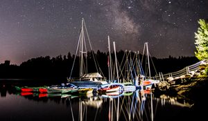 Preview wallpaper boats, pier, river, night, milky way