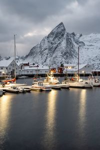 Preview wallpaper boats, pier, sea, mountains, snow