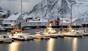 Preview wallpaper boats, pier, sea, mountains, snow