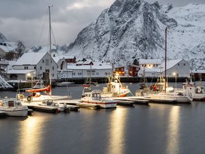 Preview wallpaper boats, pier, sea, mountains, snow