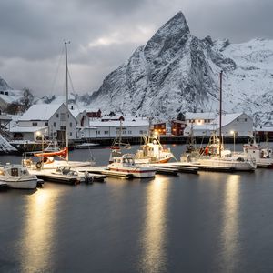 Preview wallpaper boats, pier, sea, mountains, snow