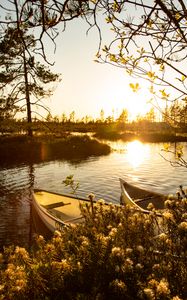 Preview wallpaper boats, river, rays, bushes