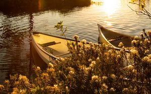 Preview wallpaper boats, river, rays, bushes