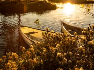 Preview wallpaper boats, river, rays, bushes