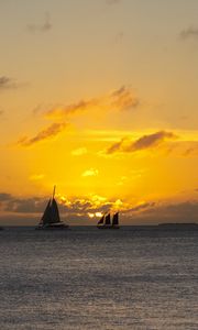 Preview wallpaper boats, ships, sails, silhouettes, sea, sunset