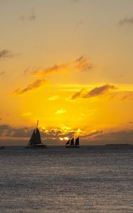 Preview wallpaper boats, ships, sails, silhouettes, sea, sunset