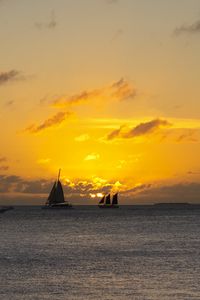 Preview wallpaper boats, ships, sails, silhouettes, sea, sunset